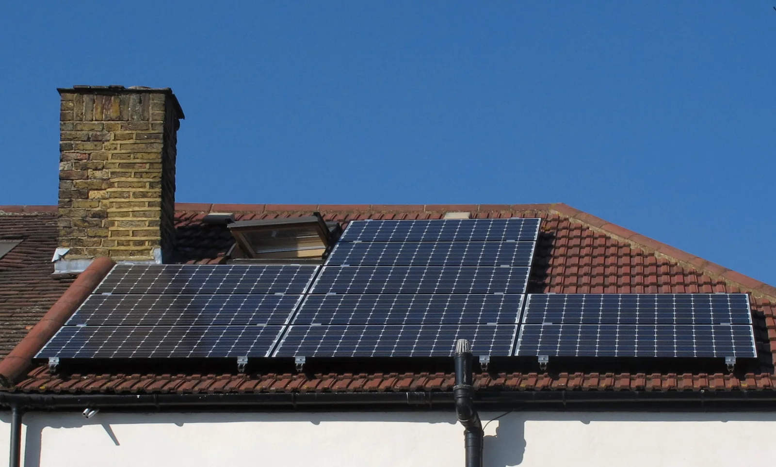 Solar PV panels installed in place on a rooftop during installation.